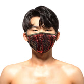 A red and black sequined face mask with gold embroidery details from MetroMaleWear metal paisley collection