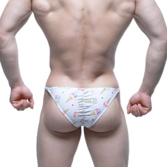 White swim trunks by MetroMaleWear featuring a playful colorful ice cream cone and sprinkle pattern