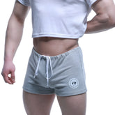 Metro malewear fit shorts gray heathered sweatshorts with white drawstring and circular fit logo patch on lower left leg