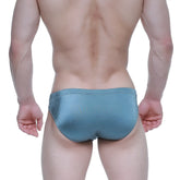 A sleek teal metroMalewear forest bikini swim trunk with a smooth glossy finish ideal for swimming