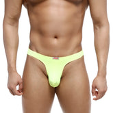 Bright neon green microfiber MetroMaleWear Fria thong with a small red and white brand tag at the waistband