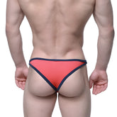 Coral-colored metro male wear infinito bikini briefs with navy blue trim designed for comfort and style
