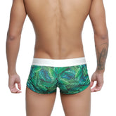 Green tropical leaf-patterned swim trunks with white elastic waistband from metromalewear jungle trunk 2026-08