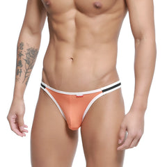 Orange MetroMaleWear link bikini thong with white and black trim highlighting its sleek design and vibrant color