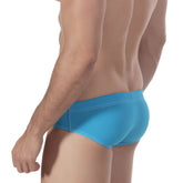 Bright blue metroMalewear lowrise swim brief in smooth, form-fitting design for comfortable beach wear