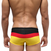 MetroMaleWear Lycos swim trunk in german flag colors black red and yellow with striped design for casual beachwear