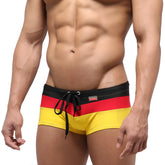 MetroMaleWear Lycos swim trunk yellow 4938-15 with Germany-themed bold black red and yellow stripes and drawstring waistband