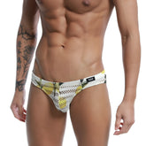 White and yellow patterned mesh swim trunks with black logo tag from metromalewear mango bikini 5103-36 collection
