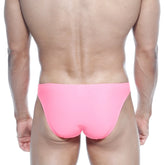 Bright pink sleek form-fitting swim trunks by metromalewear max bulge bikini fuchsia 6007-02 for swim use