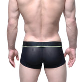 Black mesh briefs with neon green trim and nexx waistband from MetroMaleWear META TRUNK black 2026-75 collection