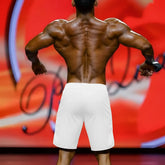 White athletic shorts with clean minimalist design from MetroMaleWear MetroMuscleWear IFBB Pro mens physique board short