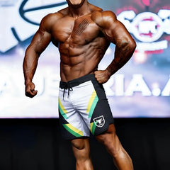 Black white and green athletic shorts with bold diagonal stripe and shield logo for metro malewear mens physique board short