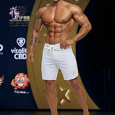 White metromalewear intensophysique board shorts with drawstring waistband and shield logo on lower right leg