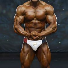 White briefs with red and navy blue side panels and a gold bull emblem from metromalewear jmusclewear competition suit