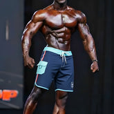 Navy blue MetroMaleWear MetroMuscleWear marine physique board shorts with light teal trim side pocket and drawstring waistband