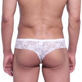 White floral lace thong from metromalewear featuring micro cheek lace design and delicate floral patterns