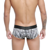 Black and white cityscape patterned men’s micro mini boxer briefs with black elastic waistband by metromalewear