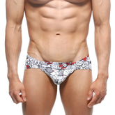 White swim trunks by MetroMaleWear Mojito Bikini Escobar 1006-09 with bold red and gray floral pattern