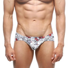 White swim trunks by MetroMaleWear Mojito Bikini Escobar 1006-09 with bold red and gray floral pattern