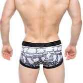 Black and white snake scale patterned men’s briefs with black elastic waistband featuring m2 brand logo metro malewear nano trunk cobra