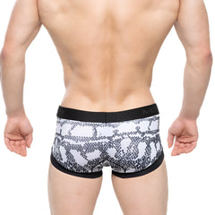 Black and white snake scale patterned men’s briefs with black elastic waistband featuring m2 brand logo metro malewear nano trunk cobra