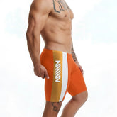 Orange and white athletic swim boxer with vertical stripe and mill branding for men by metromalewear