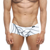 White swim trunks metroMalewear oscar boxer with bold gray abstract leaf pattern and black waistband logo
