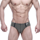 Olive green briefs with black side stripes and a small white brand tag on the waistband by metromalewear oslo thong 5102-26