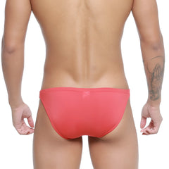 A sleek coral red MetroMaleWear Paleta Bikini 3604-13 swim trunk with a smooth form-fitting design