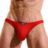 Red form-fitting cotton thong with a black logo patch on the waistband from MetroMaleWear perfect scene bikini