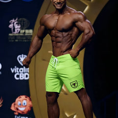 Metro male wear physique board short neon green with white drawstring and black shield logo on lower right leg