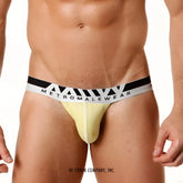 Yellow metromalewear pima cotton hip thong briefs with black and white striped waistband featuring the brand name