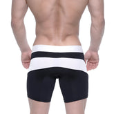 Black and white striped polyester mid boxer briefs with snug form-fitting design from MetroMaleWear Arc 10 inch