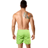Bright lime green neon green swim trunks by metromalewear designed for pool parties with lightweight quick-dry fabric