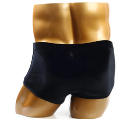 Black velvet metro malewear posingwear classic bodybuilding trunk displayed on a golden mannequin