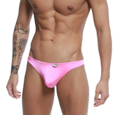 MetroMaleWear pouch thong in bright pink shiny fabric with a small metallic logo on the waistband