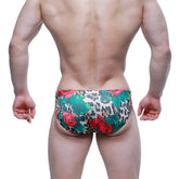 MetroMaleWear Rosee Bikini 5103-M81 swim trunks with vibrant red roses and green leaves on bold leopard print