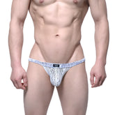 White lace thong bikini with blue patterned waistband and small black logo tag from MetroMaleWear Spy Glass collection