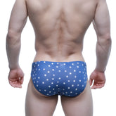 Blue MetroMaleWear Stella hip brief swim trunks with white star pattern for stylish swimwear use