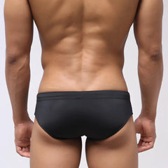 Black metroMalewear stripe swim bikini with smooth form-fitting design for comfortable swimming and beachwear