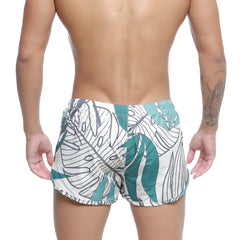 MetroMaleWear summer swim shorts meadow 4988-09 white trunks with bold teal tropical leaf pattern and black outlines