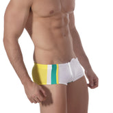 White swim trunks with bold yellow and teal vertical stripes from metro malewear surf swim boxer collection