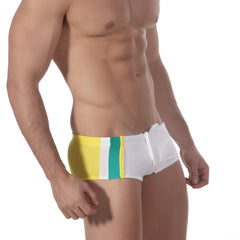White swim trunks with bold yellow and teal vertical stripes from metro malewear surf swim boxer collection