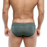 Dark green swim trunks with yellow side stripes from metromalewear swim brief campus 4923-42 for swimming use