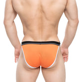 Bright orange MetroMaleWear Tomcat bikini briefs with black waistband and white trim designed for athletic use