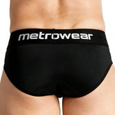Black metrowear travis briefs with white logo waistband designed for comfortable everyday wear