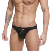 Black satin swim trunks with drawstring waistband and small red logo on the side from metromalewear vanguard collection
