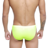 Bright neon yellow swim trunks metroMalewear vanguard swim bikini smooth form-fitting design in neon green
