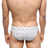 White swim trunks with black geometric mustache pattern and nassim text from MetroMaleWear Vasco Hip Brief Caballero 5103-03