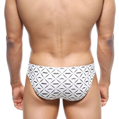 White swim trunks with black geometric mustache pattern and nassim text from MetroMaleWear Vasco Hip Brief Caballero 5103-03